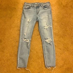 Old navy super skinny mid rise ripped jeans, light washed.